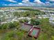 Aerial view of community tennis courts and surrounding landscape at 6405 Kilohee Ct, North Port, FL 34287