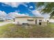Mobile home with a spacious yard and AC unit at 6405 Kilohee Ct, North Port, FL 34287