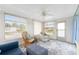 Bright sunroom with comfy seating and access to the outdoors at 6405 Kilohee Ct, North Port, FL 34287