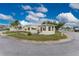 Quaint mobile home on a corner lot with palm trees at 6405 Kilohee Ct, North Port, FL 34287