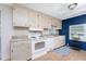 Efficient kitchen features white appliances and ample cabinetry at 6405 Kilohee Ct, North Port, FL 34287