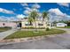Single-wide manufactured home with palm trees and carport at 6405 Kilohee Ct, North Port, FL 34287
