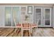 Cozy dining area with white table and chairs, coastal decor at 6965 Apopo Ct, North Port, FL 34287