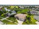 Aerial view of single-Gathering home with a three-car garage at 437 Madrid Blvd, Punta Gorda, FL 33950