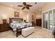 King-size bedroom with bamboo bed frame, and access to a private patio at 437 Madrid Blvd, Punta Gorda, FL 33950