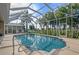 Relaxing screened pool with a view of lush landscaping at 437 Madrid Blvd, Punta Gorda, FL 33950