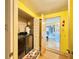 Laundry room with washer, dryer, and additional storage at 1629 Birchcrest Blvd, Port Charlotte, FL 33952