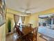 Spacious dining area with wood table and access to Florida room at 1629 Birchcrest Blvd, Port Charlotte, FL 33952
