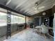 Covered patio includes table and chairs; great for outdoor dining at 1629 Birchcrest Blvd, Port Charlotte, FL 33952