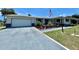 Ranch-style home with white exterior and landscaping at 1629 Birchcrest Blvd, Port Charlotte, FL 33952