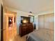 Bedroom with dresser, TV, and view down hallway at 1629 Birchcrest Blvd, Port Charlotte, FL 33952