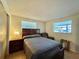 Cozy bedroom with double bed, nightstand and window at 1629 Birchcrest Blvd, Port Charlotte, FL 33952