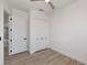 Spacious bedroom with white built-in closet and wood-look floors at 11 Pinehurst Ct, Rotonda West, FL 33947