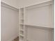 Bright walk-in closet with ample hanging space and shelves at 11 Pinehurst Ct, Rotonda West, FL 33947