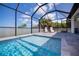 Inviting, refreshing pool with a screened enclosure at 11 Pinehurst Ct, Rotonda West, FL 33947
