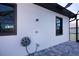 Outdoor shower with hose reel next to the pool at 11 Pinehurst Ct, Rotonda West, FL 33947