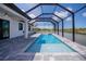 Enjoy this refreshing pool and screened enclosure at 11 Pinehurst Ct, Rotonda West, FL 33947