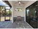 Outdoor kitchen with stainless steel appliances and a screened enclosure at 11 Pinehurst Ct, Rotonda West, FL 33947