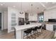 Modern kitchen with white cabinets, stainless steel appliances, and a large island at 11 Pinehurst Ct, Rotonda West, FL 33947