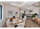Bright dining room features a wood table with seating for six and a view to the kitchen at 11 Pinehurst Ct, Rotonda West, FL 33947