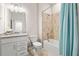 Clean bathroom with tub shower, granite vanity, and updated fixtures at 15999 Grassland Ln # 3221, Punta Gorda, FL 33982