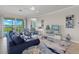 Spacious living room with large TV and comfortable seating at 15999 Grassland Ln # 3221, Punta Gorda, FL 33982