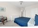 Bedroom with blue bed and a dresser at 15999 Grassland Ln # 3221, Punta Gorda, FL 33982