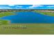 Aerial view showing a lake and golf course at 15999 Grassland Ln # 3221, Punta Gorda, FL 33982