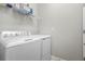 Convenient laundry room with washer, dryer, and shelving at 15999 Grassland Ln # 3221, Punta Gorda, FL 33982