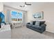 Spacious bedroom with plush carpeting, large window, and comfortable sitting area at 15999 Grassland Ln # 3221, Punta Gorda, FL 33982