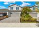Two-story townhome with attached garage and landscaped front yard at 15999 Grassland Ln # 3221, Punta Gorda, FL 33982