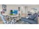 Living room featuring stylish seating and a large TV at 15999 Grassland Ln # 3221, Punta Gorda, FL 33982