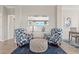Cozy sitting area with two armchairs and an ottoman at 15999 Grassland Ln # 3221, Punta Gorda, FL 33982
