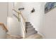 Stylish staircase with carpeted steps and white railings at 15999 Grassland Ln # 3221, Punta Gorda, FL 33982