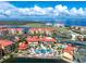 Aerial view of community, highlighting pools, tennis courts, and waterfront location at 85 Vivante Blvd # 8534, Punta Gorda, FL 33950