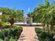 Community fountain with palm trees and brick walkways at 85 Vivante Blvd # 8534, Punta Gorda, FL 33950
