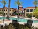 Resort-style pool area with comfortable lounge chairs and lush landscaping at 85 Vivante Blvd # 8534, Punta Gorda, FL 33950