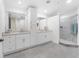 Elegant bathroom boasts double sinks, granite counters, and a large shower at 85 Vivante Blvd # 8534, Punta Gorda, FL 33950
