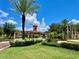 Gated community entrance with lush landscaping and a guardhouse at 85 Vivante Blvd # 8534, Punta Gorda, FL 33950