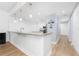Kitchen features a breakfast bar and light-colored cabinetry at 85 Vivante Blvd # 8534, Punta Gorda, FL 33950