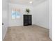 Bright bedroom with neutral carpeting and large window at 85 Vivante Blvd # 8534, Punta Gorda, FL 33950