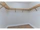 Spacious walk-in closet with ample wooden shelving at 85 Vivante Blvd # 8534, Punta Gorda, FL 33950