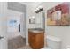 Bathroom with granite vanity and access to bedroom at 85 Vivante Blvd # 8534, Punta Gorda, FL 33950