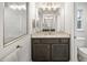 Modern bathroom with vanity, granite countertop, and shower at 10429 New Brittain St, Port Charlotte, FL 33981