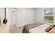 Spacious bedroom with queen bed, dresser and large window at 10429 New Brittain St, Port Charlotte, FL 33981