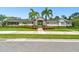 Exterior view of a community center with landscaping and a stone facade at 6516 Serenity Fall Ln, Sarasota, FL 34240