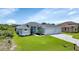 Beautiful two-car garage home with a light blue exterior at 9978 Audrey St, Port Charlotte, FL 33981