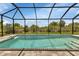 Relaxing screened pool with fountain and spacious patio at 9978 Audrey St, Port Charlotte, FL 33981