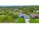 Stunning aerial view of a house with a large lot and canal views at 9978 Audrey St, Port Charlotte, FL 33981