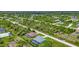 Aerial view of a residential neighborhood showcasing various houses and lush green landscaping at 9978 Audrey St, Port Charlotte, FL 33981